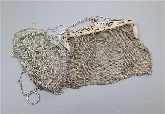 A sterling mesh evening bag and one other white metal evening bag.